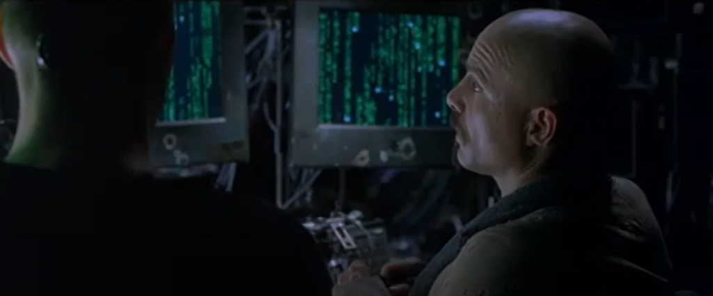 Screen grab of scene from the movie Matrix: looking at code
